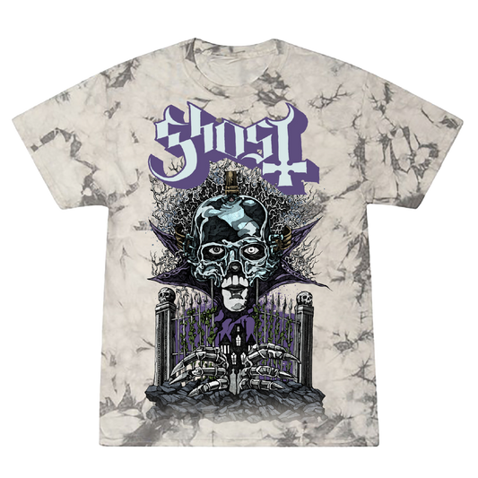 A t-shirt with a graphic print of Papa Emeritus V guards a haunted chapel, accompanied by the band name Ghost in bold purple letters. The shirt has a tie-dye design in black and grey.