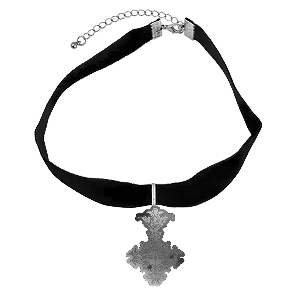 A silver choker necklace with a black velvet band and a cross pendant, presented on a black and white patterned background.