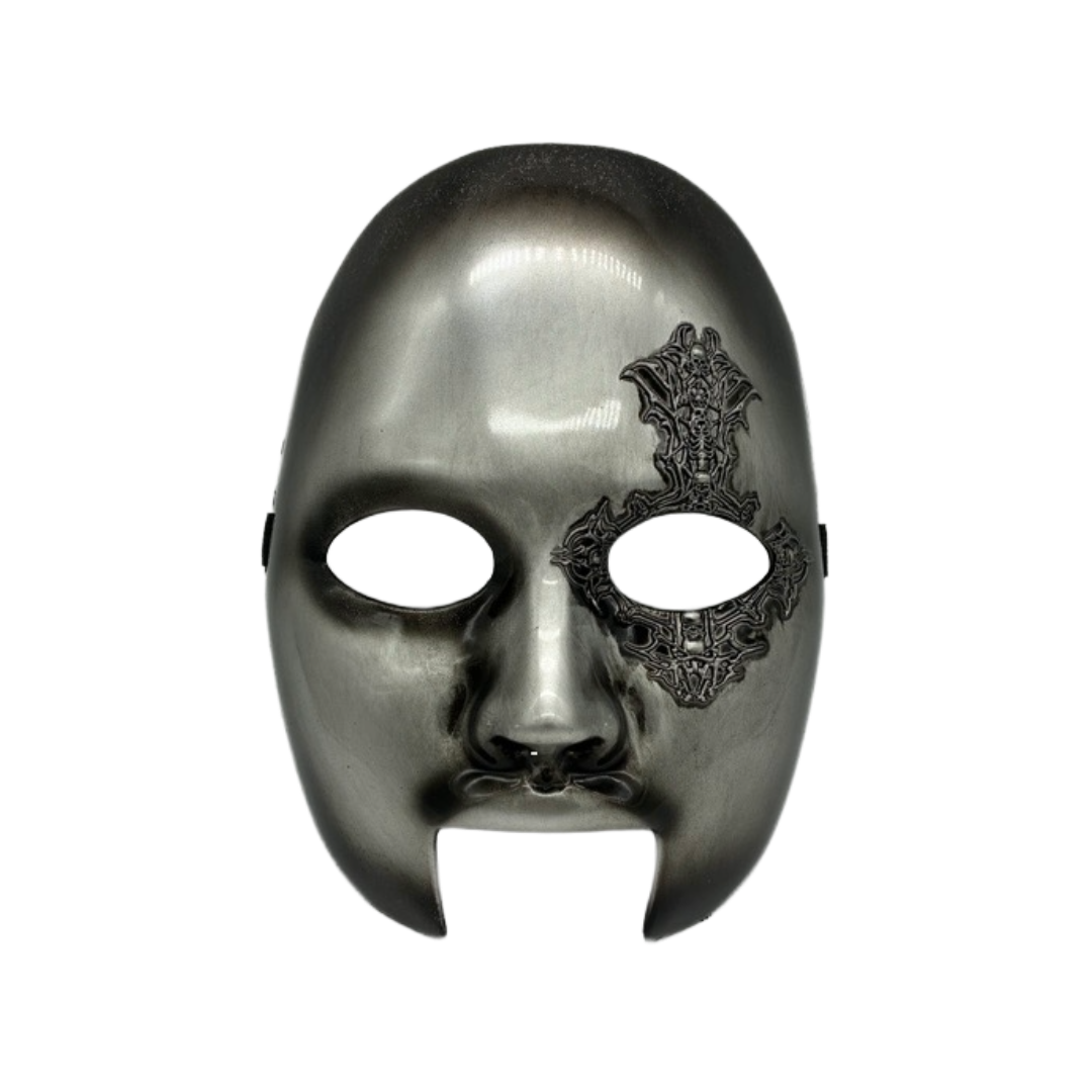 Silver mask with intricate black design on a white background