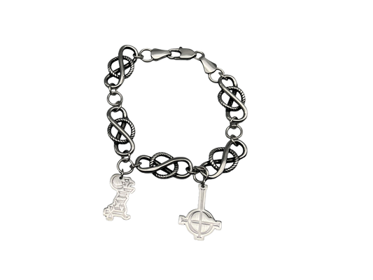 Black chain bracelet with two charms on a white background