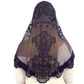 Black lace headscarf with intricate designs on a white background