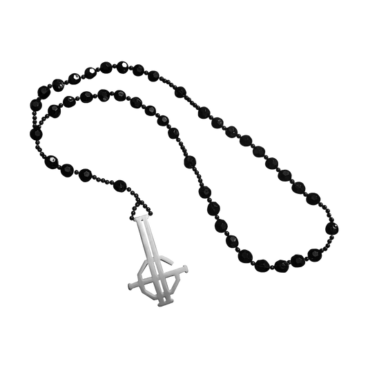Black beaded necklace with a white peace sign pendant on a white background