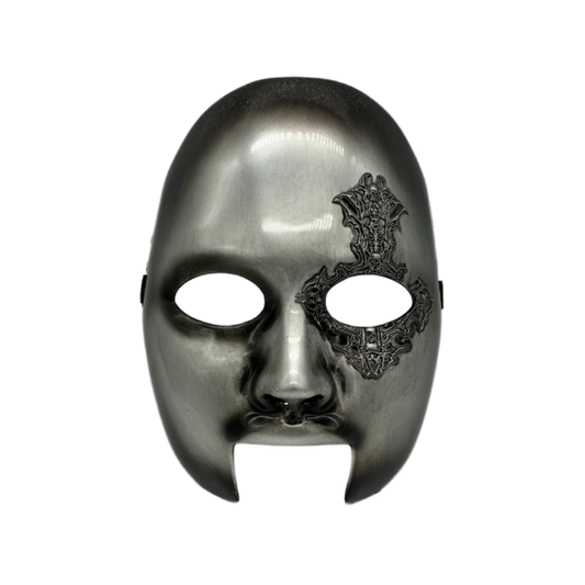 Silver mask with intricate black design on a white background