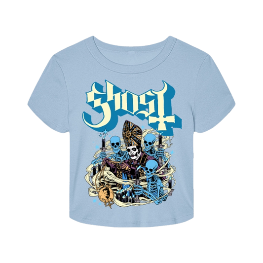 A light blue short-sleeve t-shirt with a graphic print featuring the word 'Ghost' in a stylized blue and white font above three blue skeletons with candles, shown on a plain white background.
